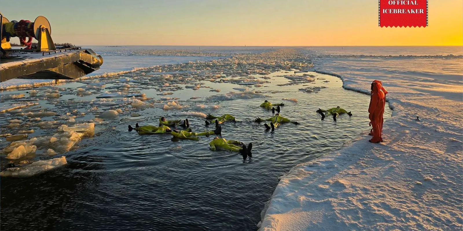 The red-and-black Sampo icebreaker breaking through thick sea ice