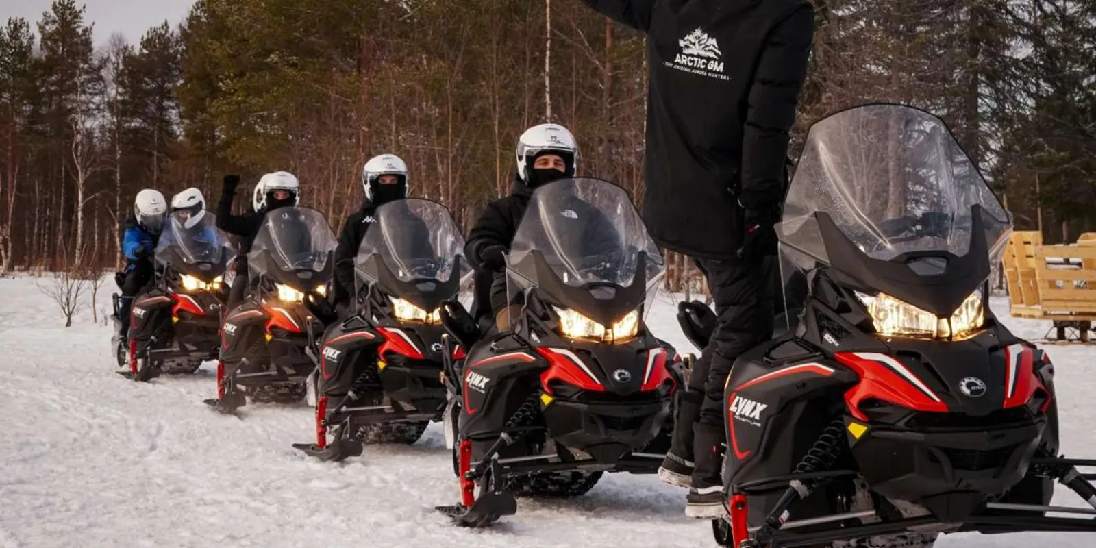 Campfire barbecue break during a Rovaniemi snowmobile safari