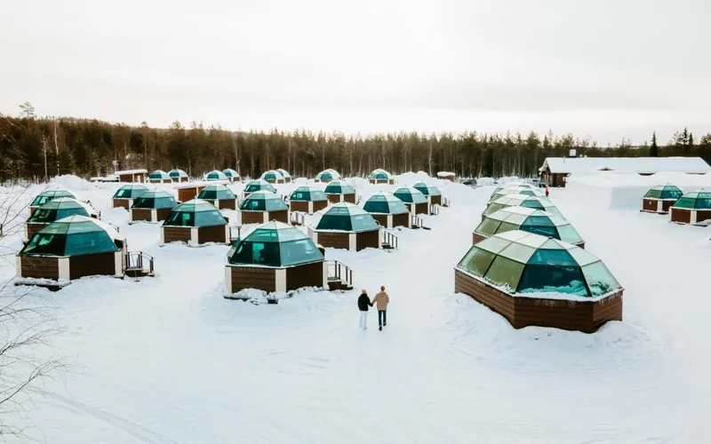 Glass-roofed igloos in the snow at Arctic SnowHotel & Glass Igloos near Rovaniemi